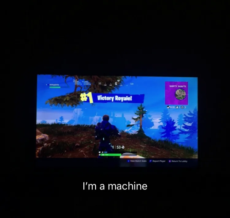 Fortnite Victory Royale on TV in dark room